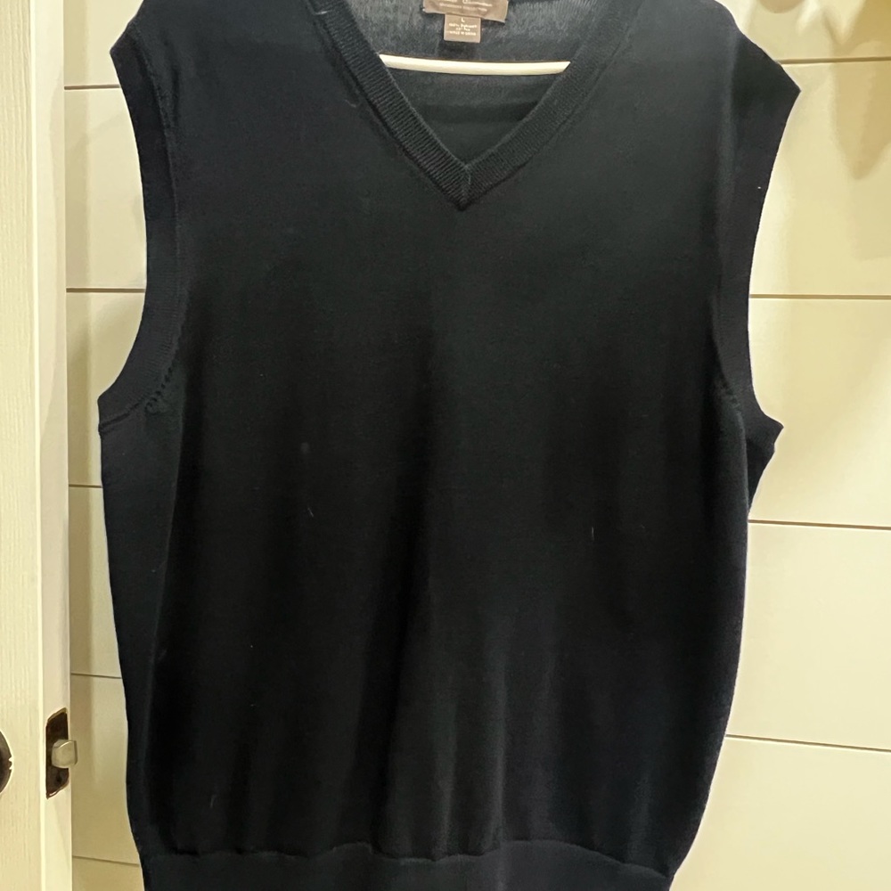Gently worn navy sweater vest.